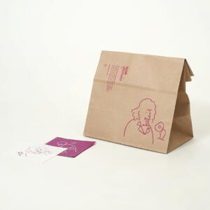 クラフト紙に描かれたポップで可愛らしいイラストが印象的なドーナツファクトリーのオリジナル紙袋