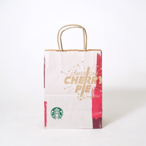 正面に新商品のイラストをフルカラー印刷で表現した、超有名コーヒーショップのクラフト紙素材のオリジナル紙袋