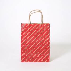 裏面にブランド名が斜めに細かく配置された、超有名コーヒーショップのクラフト紙素材のオリジナル紙袋