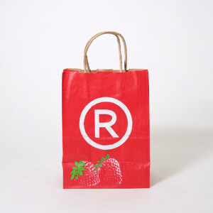 いちごのイラストと商品のハッシュタグをフルカラー印刷で大胆に描いた、超有名コーヒーショップのクラフト素材のオリジナル紙袋