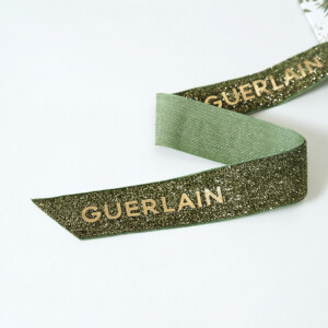 ラグジュアリーコスメブランド太幅リボンに、ラメが織り込まれたゴージャスで美しいオリジナル紙袋