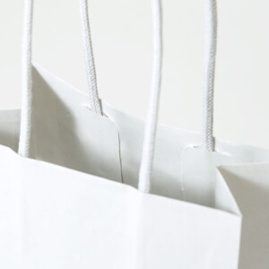 スイーツ専門店の縦留めハンドルの、オリジナル紙袋