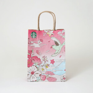 フレキソ印刷を用いて春らしい景色を描いた、コーヒーショップの桜色のオリジナル紙袋