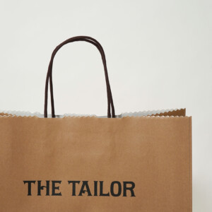 晒しクラフト用紙にキャメル色が印刷された、チョコレート専門店の上品なオリジナル紙袋