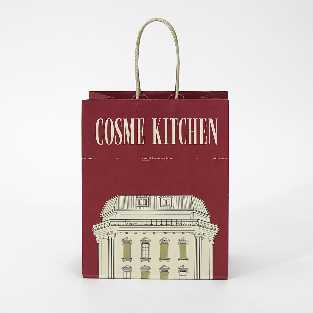 ワインレッド色の高級感漂うセレクトコスメショップのホリデー限定紙袋