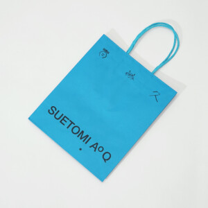 お菓子ブランドの、ワンカラーでも目を惹く、紙丸紐ハンドルとクラフト紙の風合い豊かなオリジナル紙袋